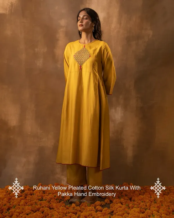 This is our Ruhani Yellow Pleated Kurta, a piece that embodies the spirit of our craft. Made from a soft cotton-silk blend and adorned with intricate Pakka hand embroidery, it’s designed to move with you, bringing a touch of festive light to your everyday moments.