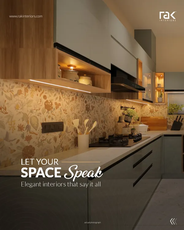 Let your space speak with elegant interiors. This kitchen features a beautiful floral backsplash, sleek grey cabinets, and warm wood accents, creating a perfect blend of modern design and classic charm.