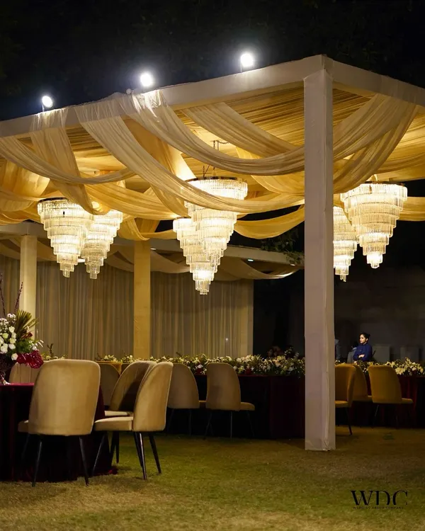 A night of royal elegance. We used shimmering chandeliers and flowing golden drapes to create a timeless and grand reception experience, where every detail exuded luxury and charm.