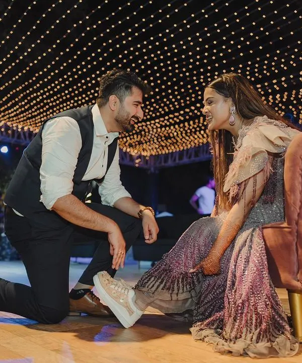 A sweet, romantic moment between the couple under a canopy of fairy lights during their Sangeet. I create intimate spaces for you to connect amidst the celebration.