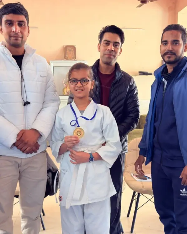 A proud moment with one of my students after she won her gold medal. Her hard work in our dedicated girls' batch paid off.