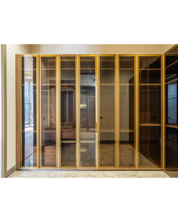 A walk-in closet is a personal luxury. I designed this one with fluted glass and brass-finished frames, allowing the clothes to be subtly visible while maintaining an elegant, clean look. The marble flooring adds to the sophisticated feel.
