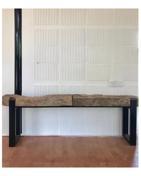 This rustic bench combines a raw-edged wooden top with a sleek metal base. Designed for a farmhouse, it embodies my principle of using fewer, locally available materials to create sustainable and earthy furniture that connects with its natural surroundings.