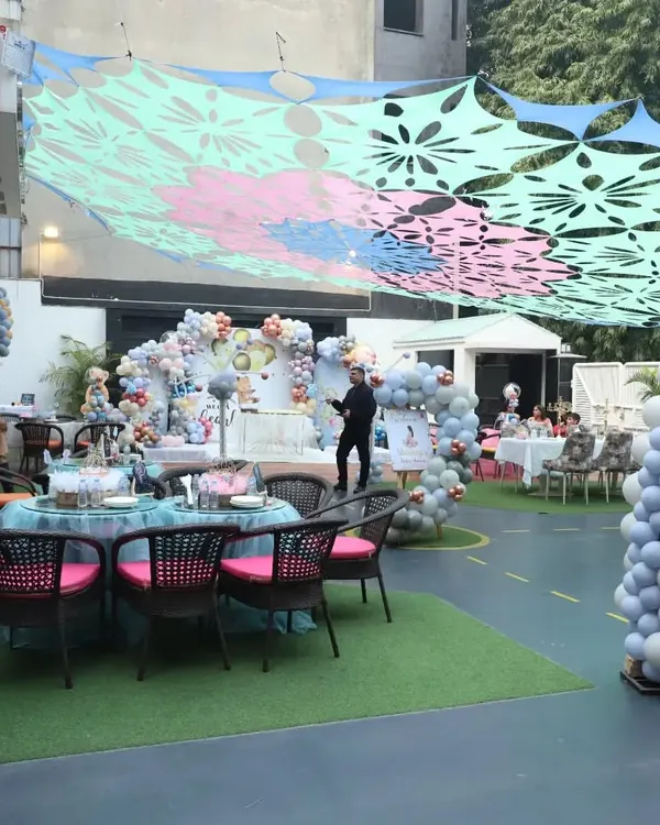 A wide view of our outdoor area set up for a large birthday celebration. The space is versatile, accommodating elaborate decorations, guest seating, and plenty of room for kids to play.