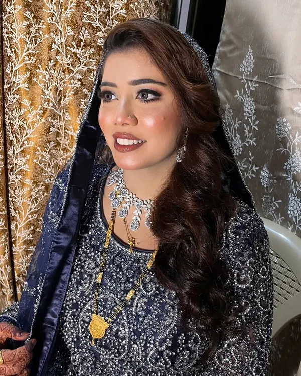 This bride's royal blue outfit was absolutely breathtaking. I created a smokey eye and a soft nude lip to complement the richness of the color. She looked so elegant and unique.