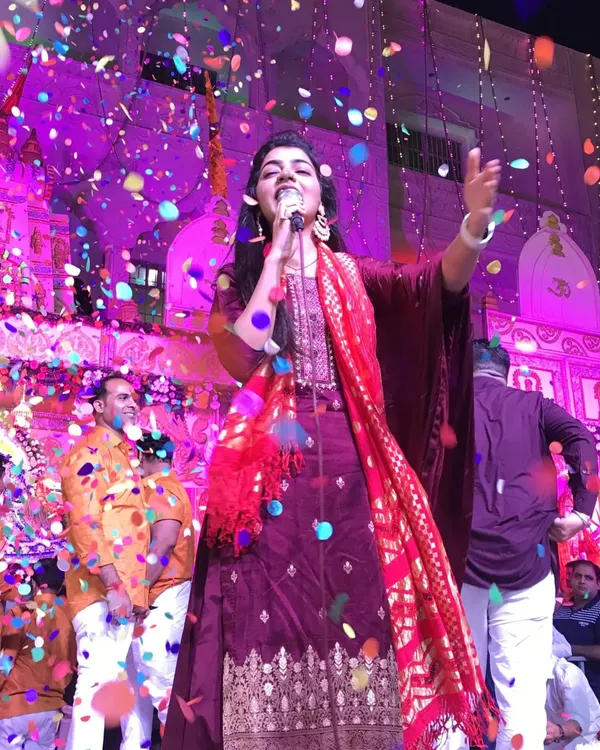 This is the energy I bring to every performance. For me, singing bhajans is a form of prayer, and it's pure bliss when the entire audience joins in, celebrating with such devotion and joy. This moment from a Shyam Baba kirtan in Nazafgarh, with confetti in the air, perfectly captures the divine celebration I strive to create.