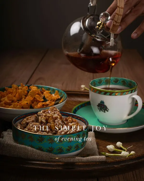 For me, happiness is the simple joy of evening tea, made perfect with a homemade snack. This is a scene from my own home, featuring my crunchy peanut chikki and savory corn mixture, ready to solve those little 'choti-si-bhookh' moments. It’s a ritual I cherish, and one I hope to share with you.