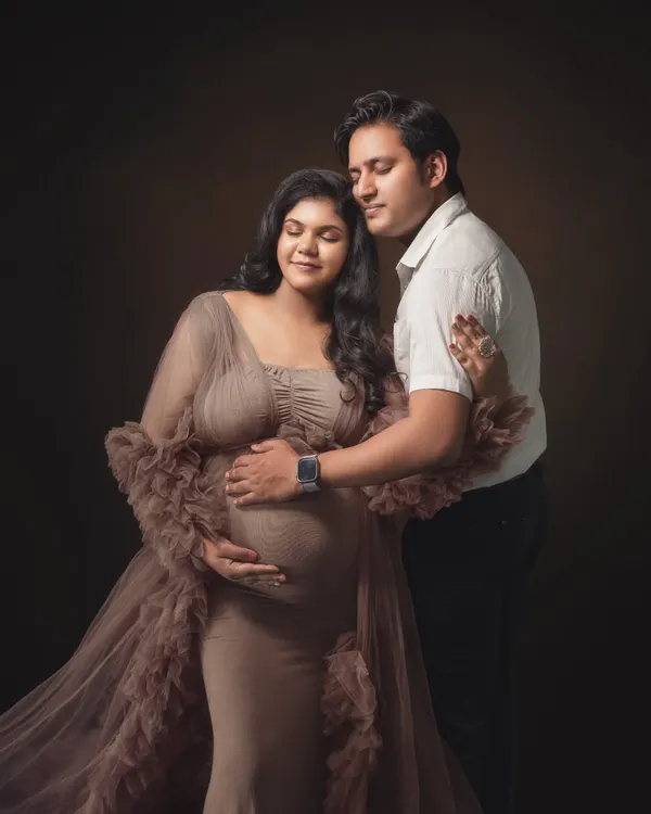 With eyes closed and hearts open, they share a quiet moment of anticipation. I used soft, painterly lighting to wrap them in warmth, emphasizing the serene and powerful connection between them in this classic maternity portrait.