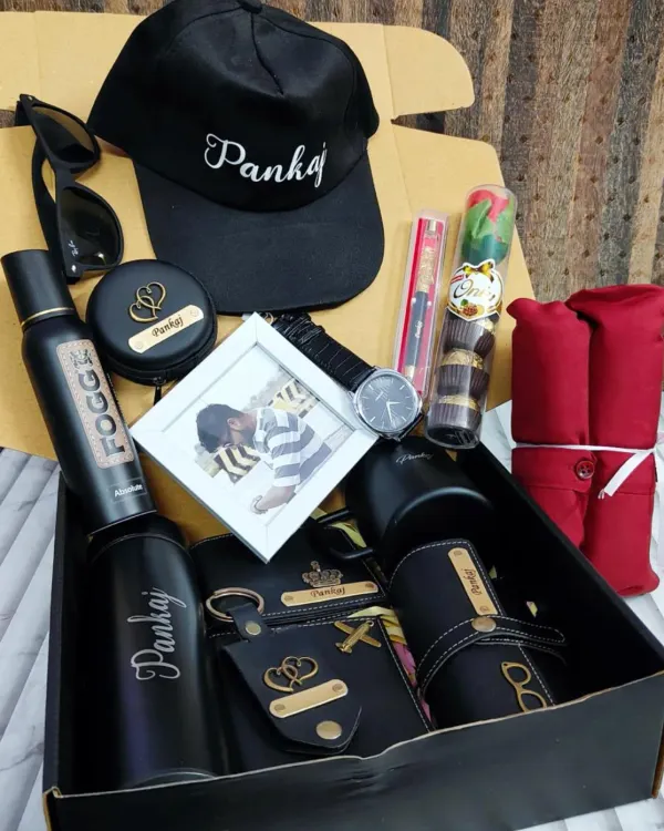 This ultimate gift box has it all. It includes a personalized cap, bottle, wallet, keychain, and eyewear case, plus a watch, photo frame, and other accessories. I can help you build a custom hamper like this based on what he loves.