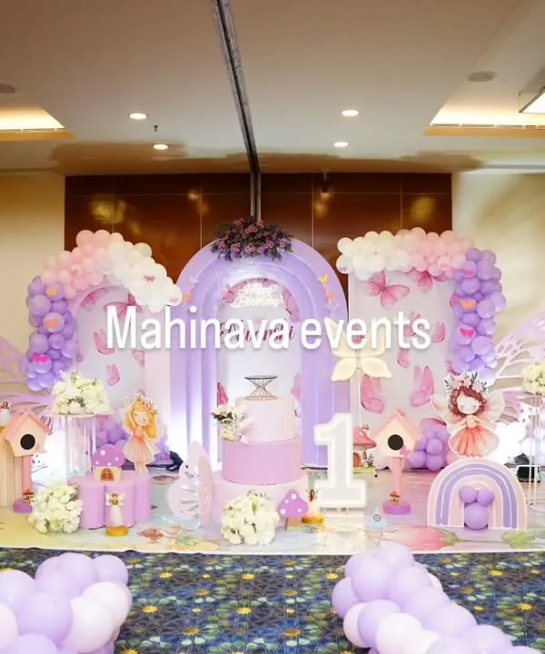 This enchanting fairy garden theme is one of my favorites for first birthdays. I use a mix of pastel balloons, whimsical props like mushrooms and birdhouses, and custom fairy cutouts to create a magical world for your little one's special day.