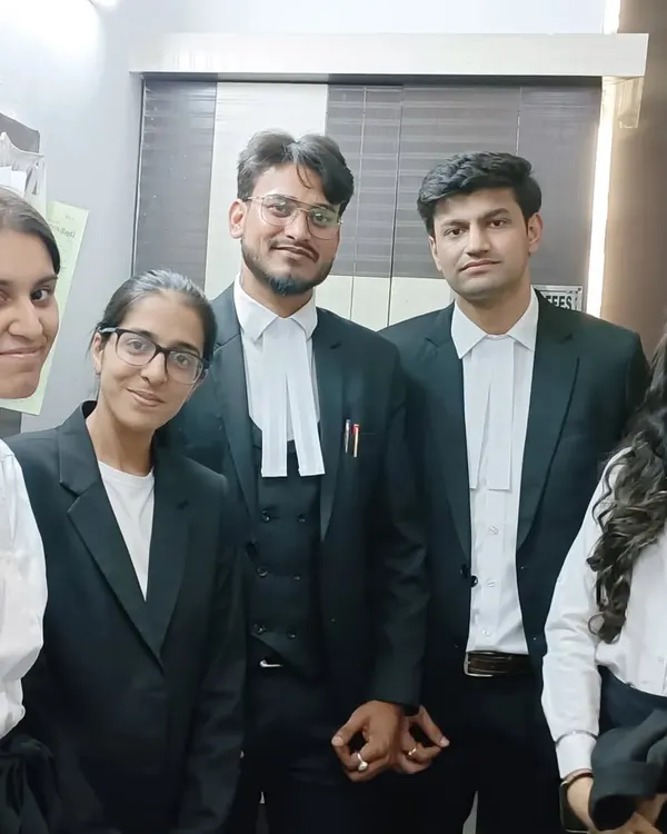 With my talented team of associates at Empyreal Law Offices. We work together to build strong defense strategies for our clients.
