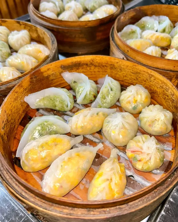 My live dim sum station is a journey into Asian cuisine. I offer a variety of handcrafted dumplings, including corn and water chestnut, edamame truffle, and mixed vegetable, all steamed to perfection in traditional bamboo baskets.