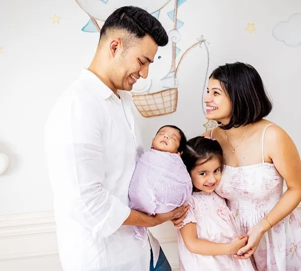 A beautiful family of four celebrating their newest member. I love capturing these moments against the backdrop of your baby's own nursery.