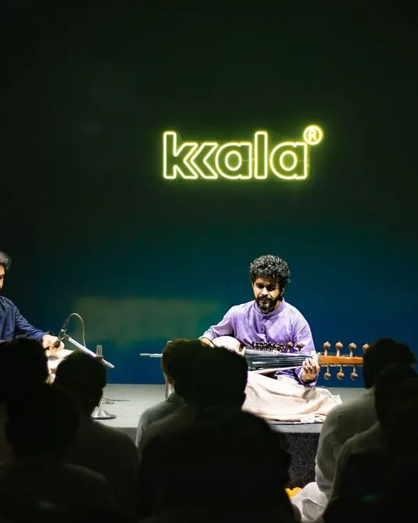 Performing at a 'Kala' concert, providing tabla accompaniment for a talented sarod artist. The dark, intimate setting allowed for a deeply focused musical dialogue.
