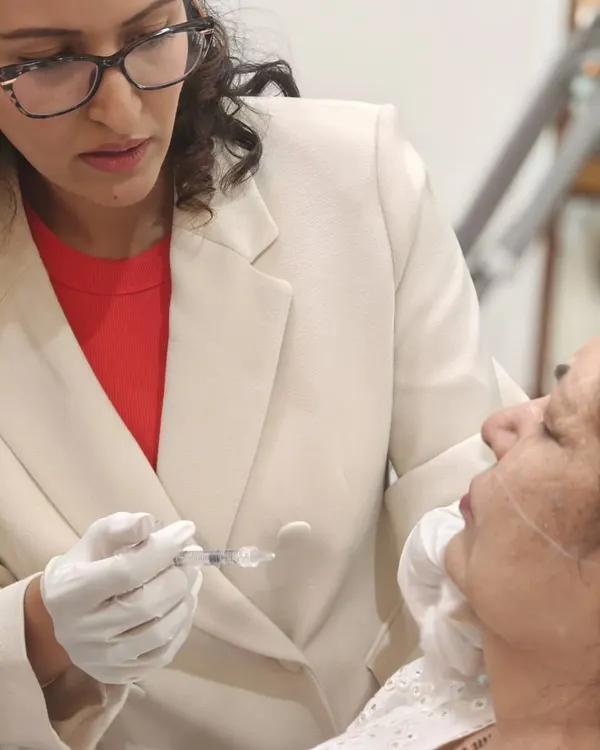 A close-up view of a dermal filler injection during a training session. My focus is always on the precise placement of the product to ensure a natural and balanced result, whether I am treating a patient or teaching fellow doctors.