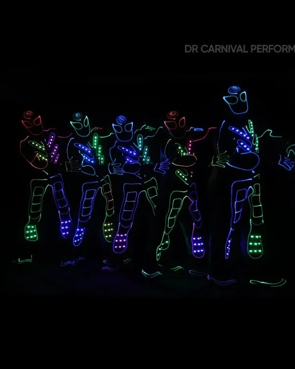 A team of our Tron dancers posing in their multi-colored LED suits. This is the future of dance, ready to light up your event.