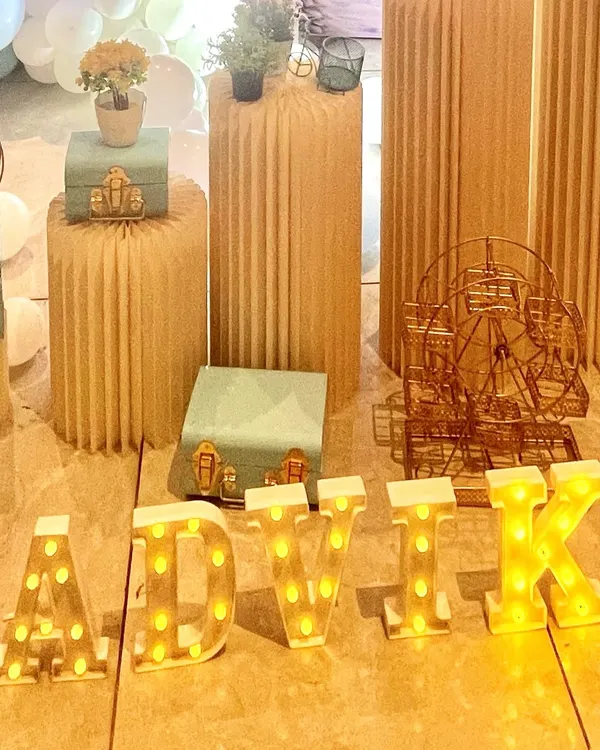We offer personalized light-up marquee letters, like this 'ADVIK' sign, to add a special and bright touch to any celebration.