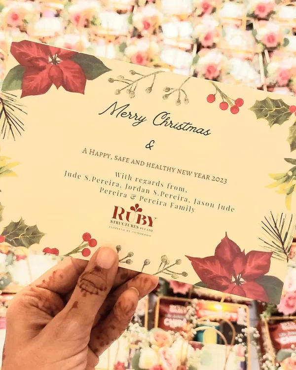 Spreading holiday cheer with our custom Christmas hampers. This image shows the personalized greeting card we designed for a client's bulk holiday order.