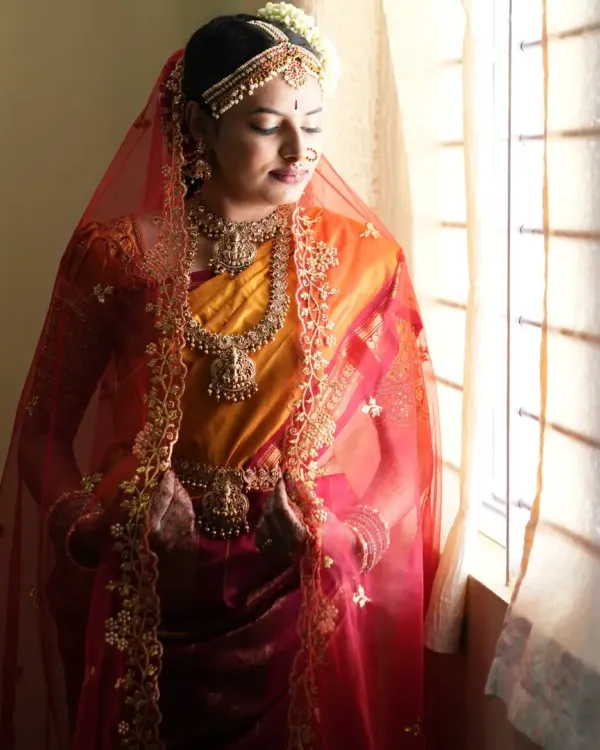 This is the classic South Indian bridal look I love to create. For Yashwini's Muhurtham, I focused on radiant skin and defined eyes that would look beautiful both in person and in photographs, ensuring her natural beauty was the highlight.