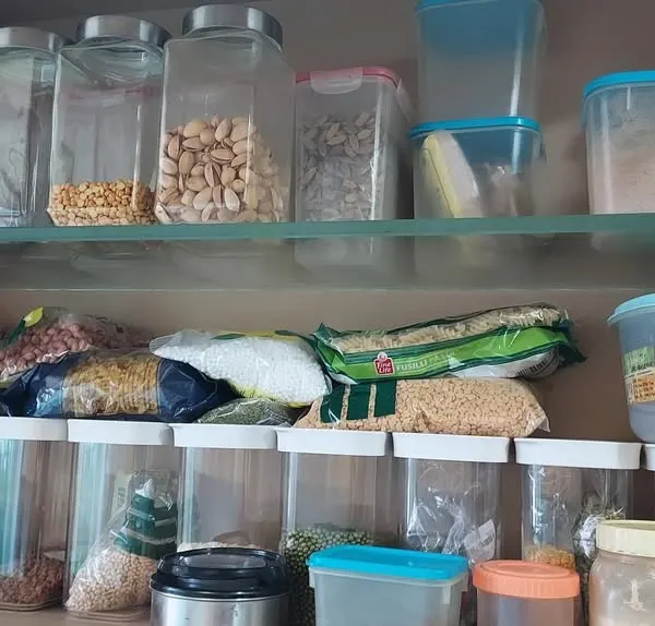 This is a common sight in many kitchens, a pantry filled with open packets and clutter. This is the 'before' state, the chaos that we transform into a functional, streamlined system.