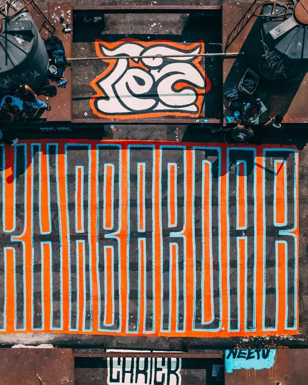 This is how we make a statement in Mumbai. Taking art to the rooftops with my crew, painting massive typography that can be seen from the sky. This is more than just paint, it's about representing the scale of our vision.