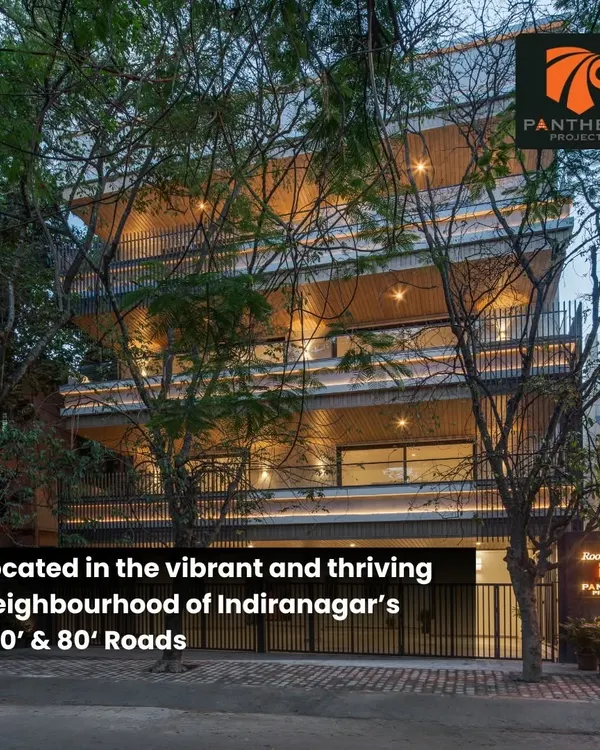 The Panthera RoofGardens project in Indiranagar, viewed from the street, shows our use of natural wood tones and vertical lines to create a warm, modern apartment building.