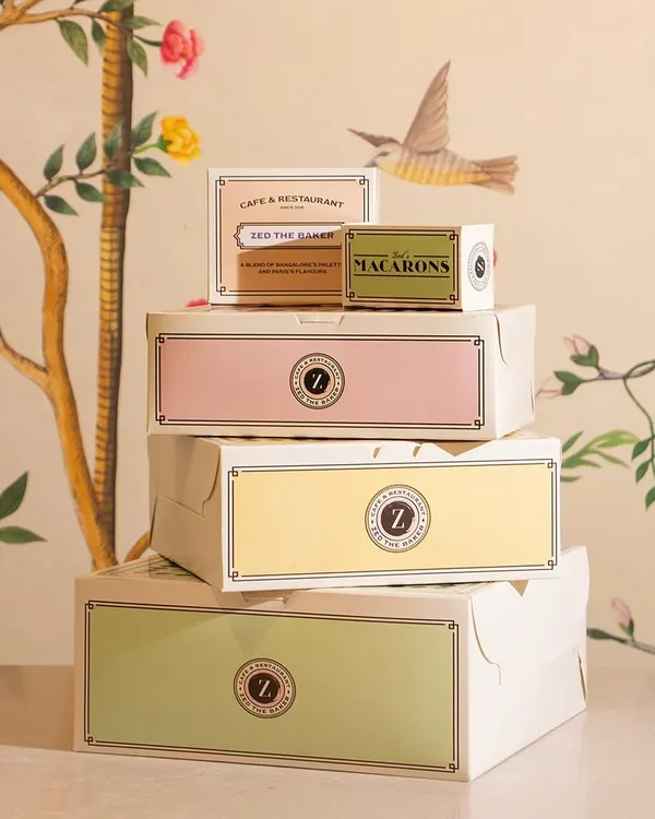 My range of pastel-colored, French-inspired packaging, stacked beautifully. Each box is designed to make the unboxing experience as delightful as the treat inside.