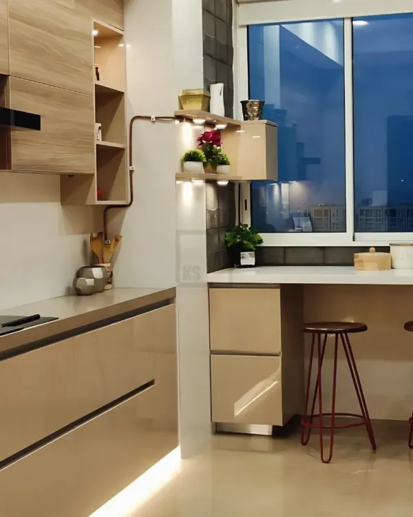 A closer look at the breakfast bar setup. It’s a perfect spot for a morning cup of tea or for kids to do their homework, making the kitchen a multi-functional family space.