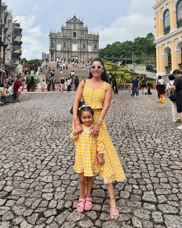 Here I am with my daughter Aarriya, the heart and soul of my brand. We design adorable matching outfits like this yellow gingham check co-ord set, perfect for creating beautiful memories on your family vacations.