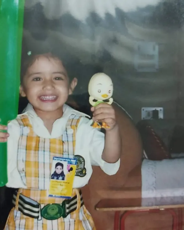 This is me, little Nonu. I started just by humming songs to myself, and I never imagined that one day so many people would connect with my music. This picture reminds me to stay true to that little girl.