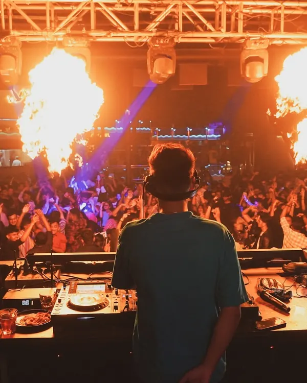 From behind the decks, I command the energy of the entire venue. This is a glimpse of a packed show in Pune, where I brought the heat with a full pyrotechnic setup, turning the night into a festival-level experience.