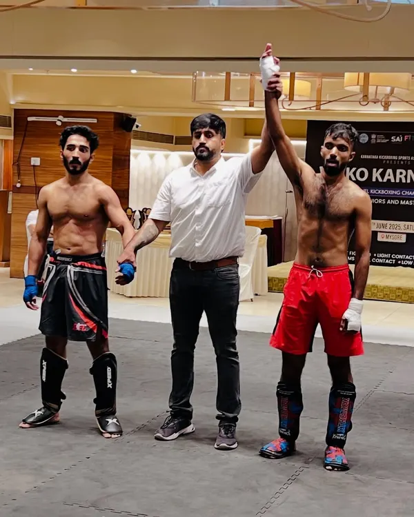 This is the moment we train for. A UMC warrior's hand raised in victory at the 5th State Level Kickboxing Championship. We don't just teach you to fight; we train you to win.