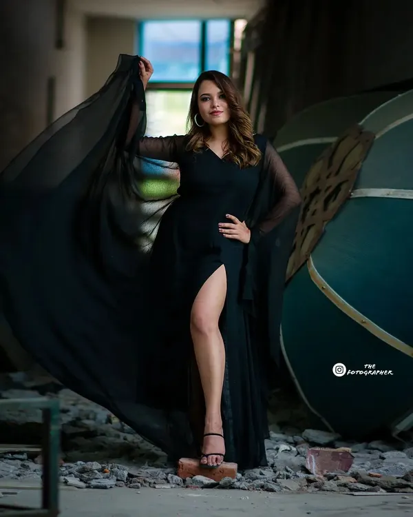 This is a hero shot from a fashion portfolio session in an industrial location. I love playing with dramatic poses and flowing fabrics to create powerful, high-fashion images like this one.