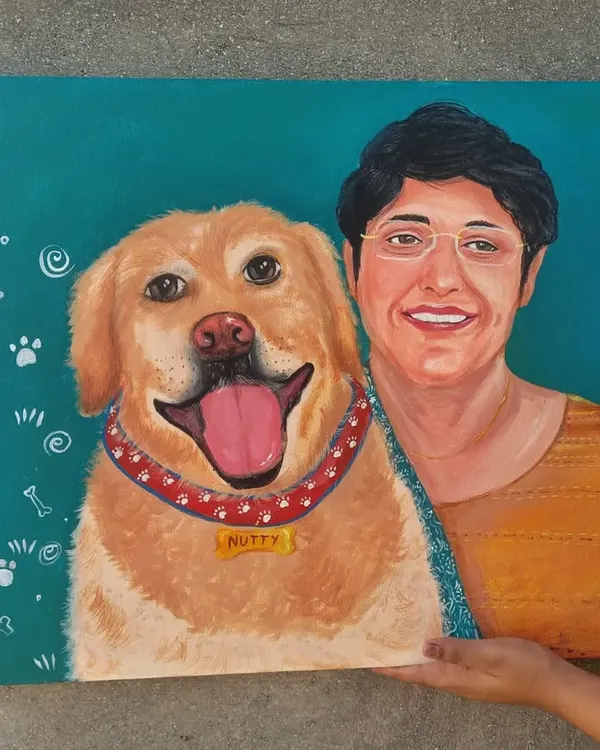 A full view of the custom acrylic painting for Nutty the golden retriever and his human. I added fun little doodles like paw prints and bones to capture his playful personality.