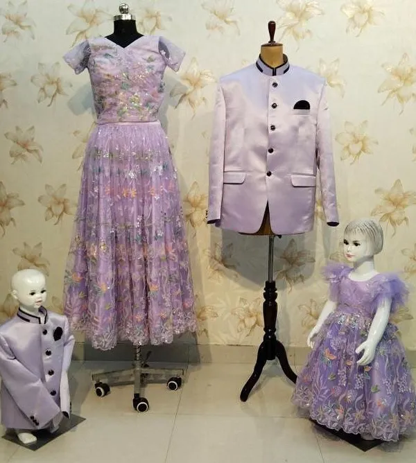This lavender family set on display shows how I coordinate outfits for everyone. It includes an embroidered gown for mom, a matching frock for the daughter, and stylish jackets for dad and son.