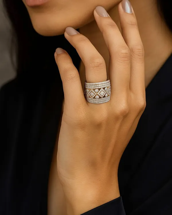 Some rings are accessories, this one is a statement. Worn on the hand, this wide, intricately patterned diamond ring is a reflection of power, grace, and individuality.
