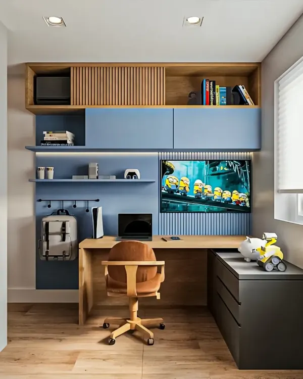 A compact and highly functional kid's room with a built-in desk, perfect for homework and gaming. The design includes clever storage solutions like overhead cabinets and a pegboard for organizing accessories.