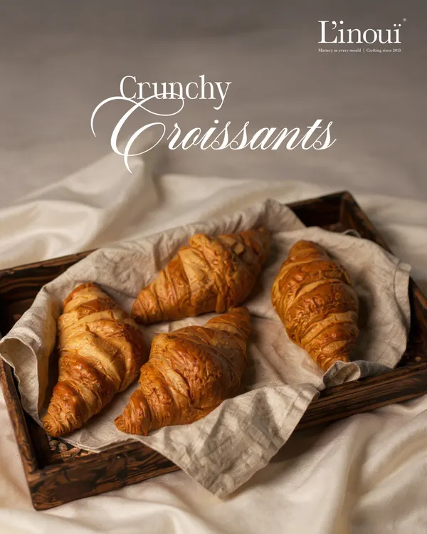 This is what a perfect croissant looks like. Golden-brown, with countless flaky layers that promise a satisfying crunch, giving way to a soft, buttery interior. It’s the ideal start to any morning.