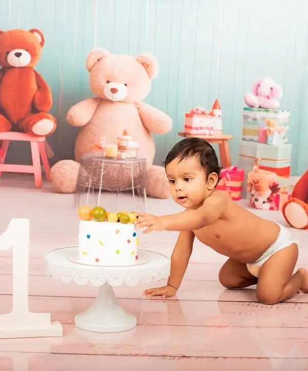 The moment of discovery during a first birthday cake smash. I capture every curious touch and sweet taste in these fun-filled studio sessions.