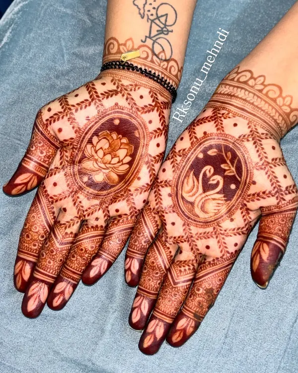 The beautiful result of my herbal henna paste. This photo shows the rich, dark stain of the lotus and swan design after the paste has been removed, a sign of pure, high-quality ingredients.
