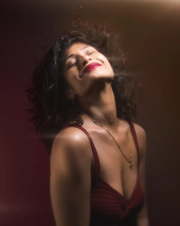 A dynamic studio portrait where we used lighting to freeze the motion of her hair. This kind of shot adds so much energy and life to a portrait session.