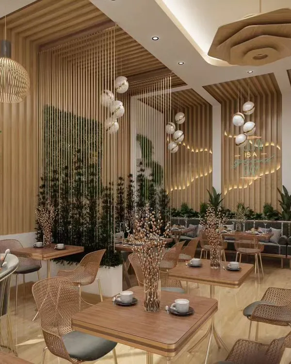 A nature-inspired cafe design featuring light wood, wicker furniture, and cascading decorative elements. The layout provides a variety of seating options, from intimate two-person tables to larger banquettes, creating a serene and welcoming atmosphere.