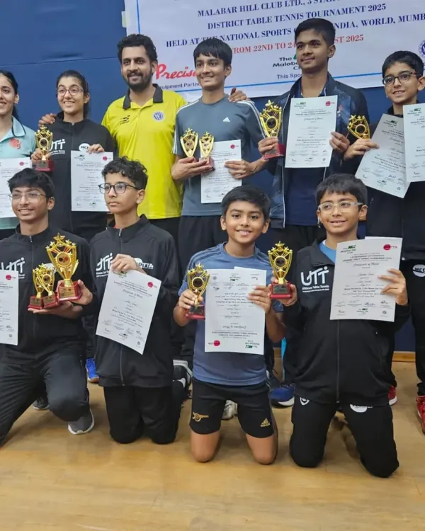 This picture captures the heart of our academy. It shows me with a group of our talented young players from the NSCI-UTT academy after a successful run at a 3-Star District Ranking Tournament. Seeing them all with their trophies and certificates is what makes coaching so rewarding.