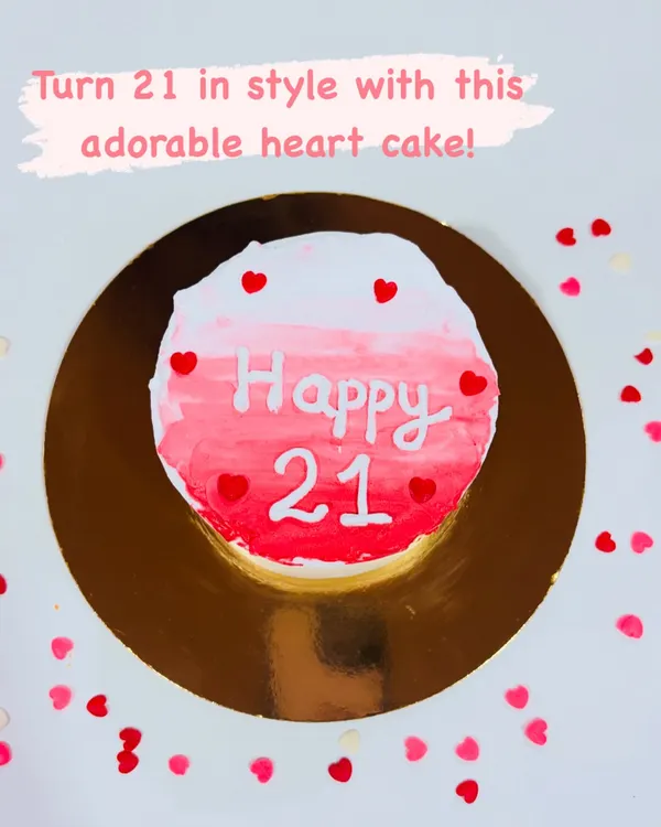 Celebrate turning 21 in style with this cute and classy minimalist cake. The design features a pink ombre watercolor effect and is dotted with tiny red hearts for a sweet, modern look.