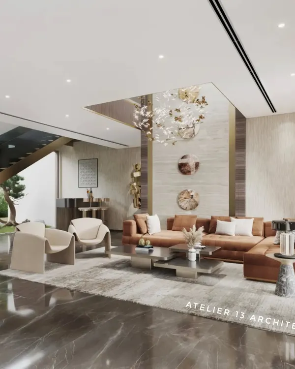 A wider perspective of the luxury family lounge, this view shows the relationship between different functional areas. The seating arrangement is oriented towards a double-height feature wall, while a sleek bar area is neatly tucked under the modern staircase, maintaining an open, airy feel.