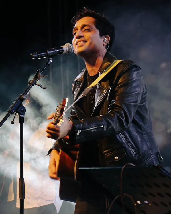 A classic shot of Nikhil D'Souza with his guitar during a soulful performance at Impressions, COEP. He is one of the most sought-after indie artists for college festivals.
