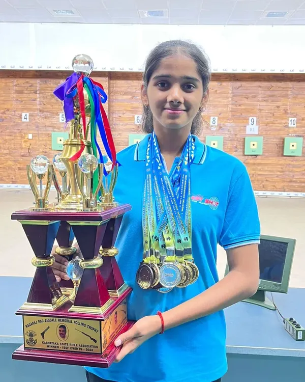 Our rifle shooter Anushka holding a well-deserved trophy and a collection of medals after a series of outstanding performances in the 10m air rifle event.
