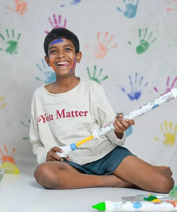 Holi is a festival of joy, and these photoshoots capture that perfectly. We use a colourful handprint backdrop and safe, vibrant powders for a fun and memorable session. It's even more fun when a furry friend joins in!