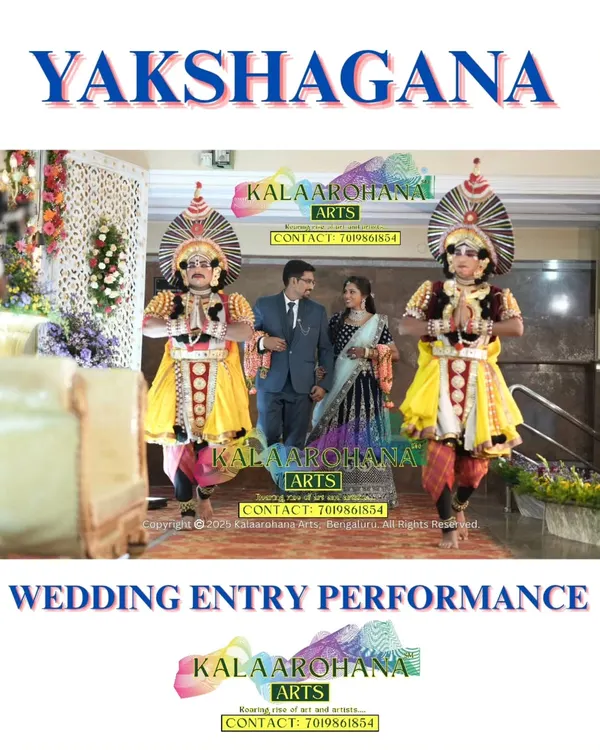 A beautiful moment captured as a couple makes their wedding entrance, guided by our Yakshagana performers in their striking traditional attire and large headgear.