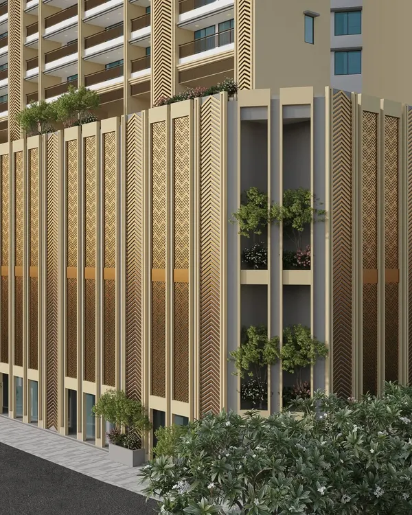 A close-up of the facade of our high-rise project in Mulund. This view highlights the detailed perforated screens and vertical elements that blend modern design with traditional patterns, creating a unique architectural texture.